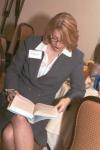 RuthAnn Hogue reads from John Stossel's book shortly before meeting him at an event in Tucson, Arizona.