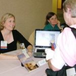 RuthAnn Hogue sells and signs books during NFPW Annual Conference in Seattle.